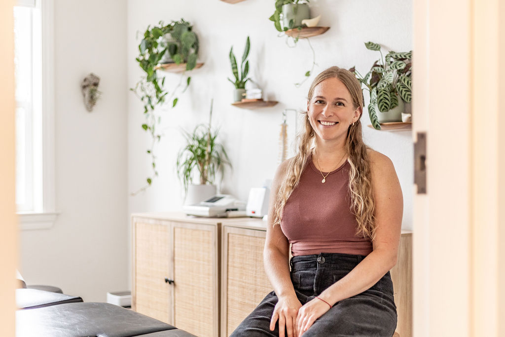 Dr. Laura Barnum seated in her clinic
